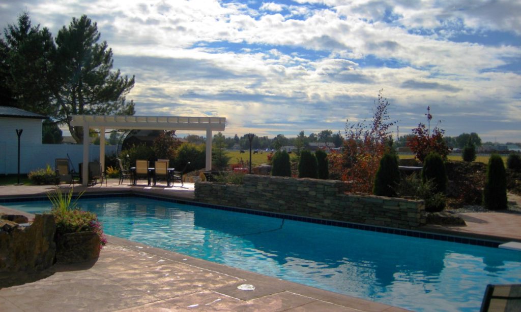 An inviting swimming pool newly opened for spring by Mastercraft Pool & Spa.
